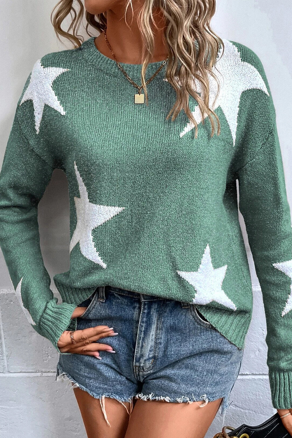 Suéter de punto con hombros caídos y estampado de estrellas verdes