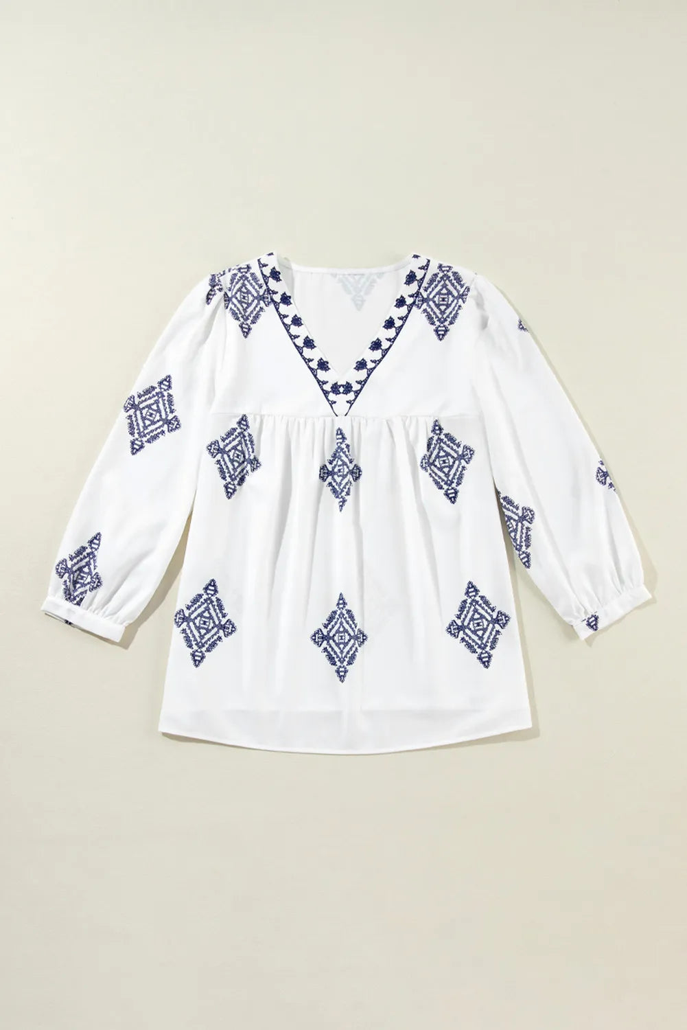 Blusa estampada con escote en V y mangas tres cuartos