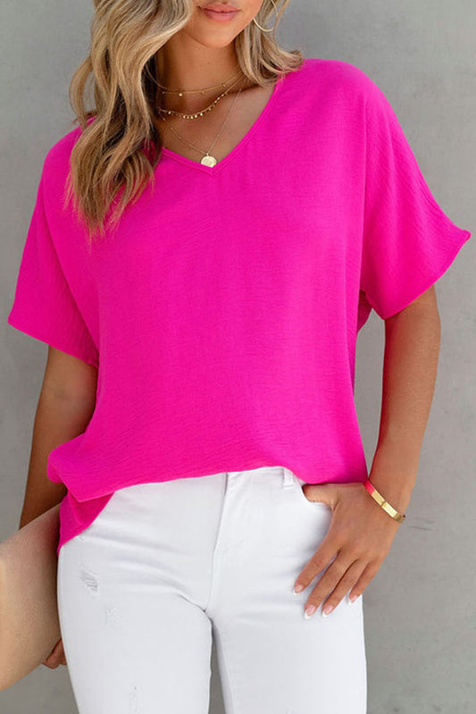 Blusa básica de color liso con escote en V y manga corta en rosa