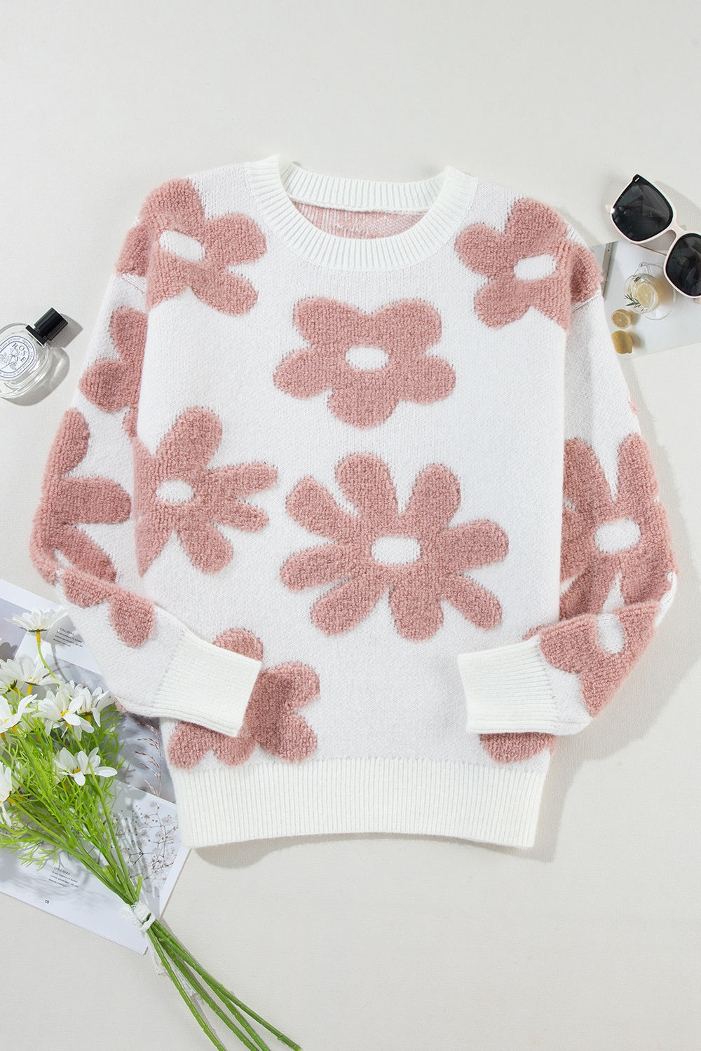 Blusa de punto con cuello redondo y manga larga con flores