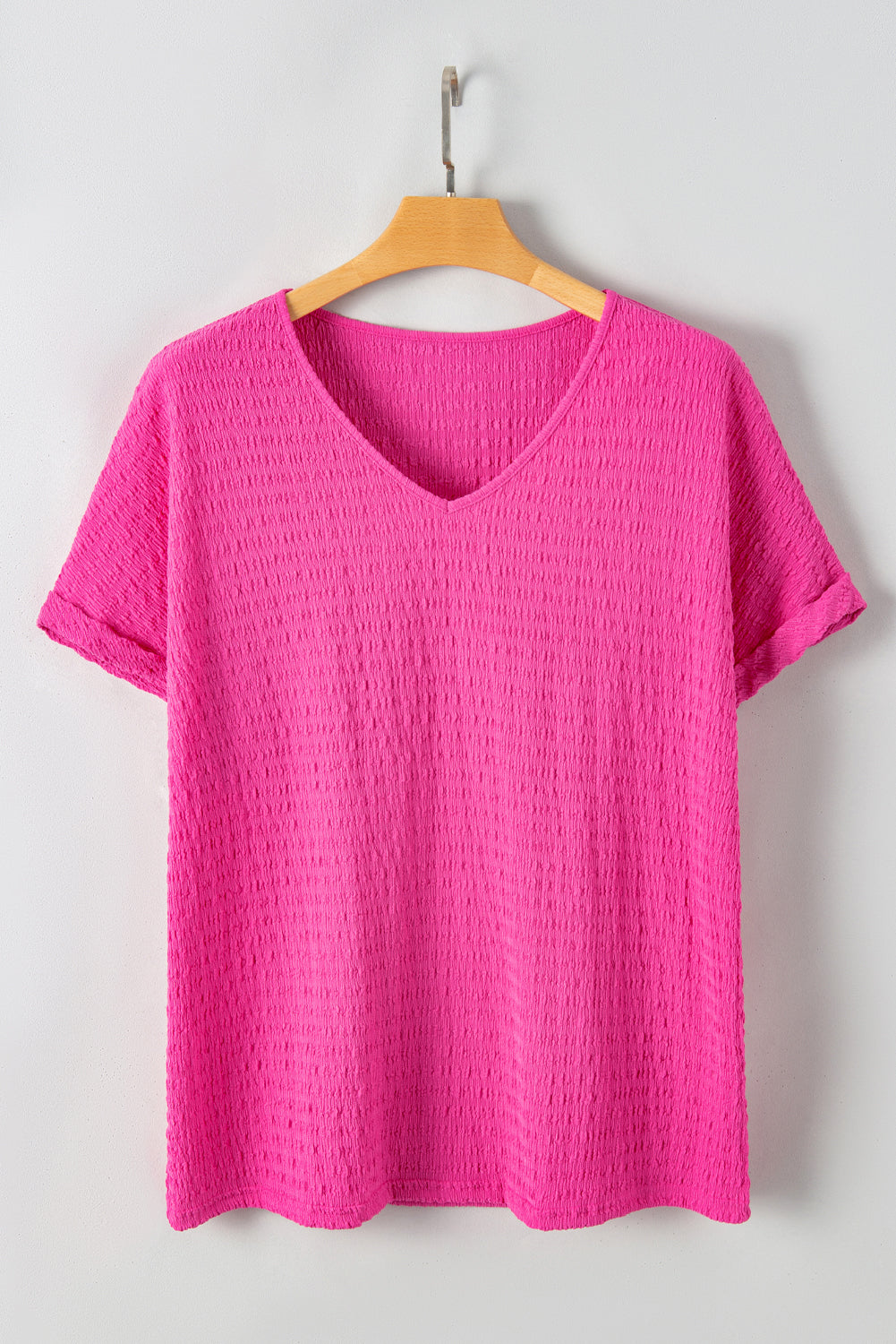 Blusa de talla grande con escote en V y mangas murciélago con textura en color rosa brillante