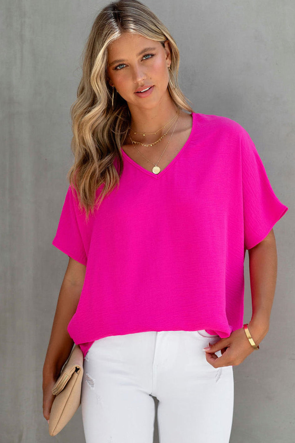 Blusa básica de color liso con escote en V y manga corta en rosa