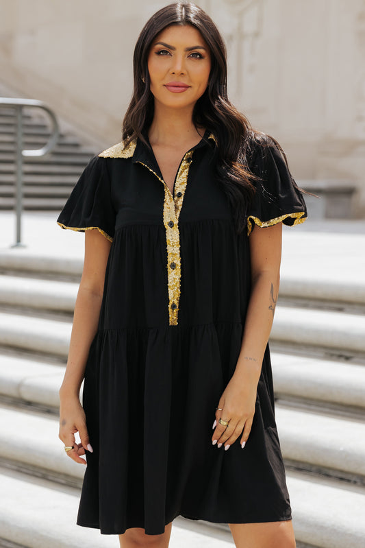 Vestido camisero para el día del juego con mangas abullonadas, color negro y ribete de lentejuelas doradas