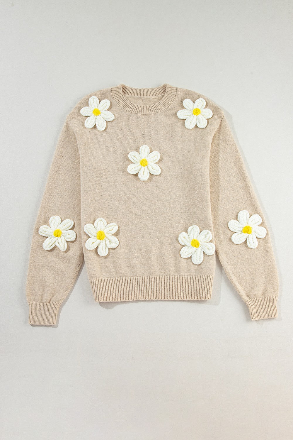 Suéter de manga larga con cuello redondo y flores de crochet