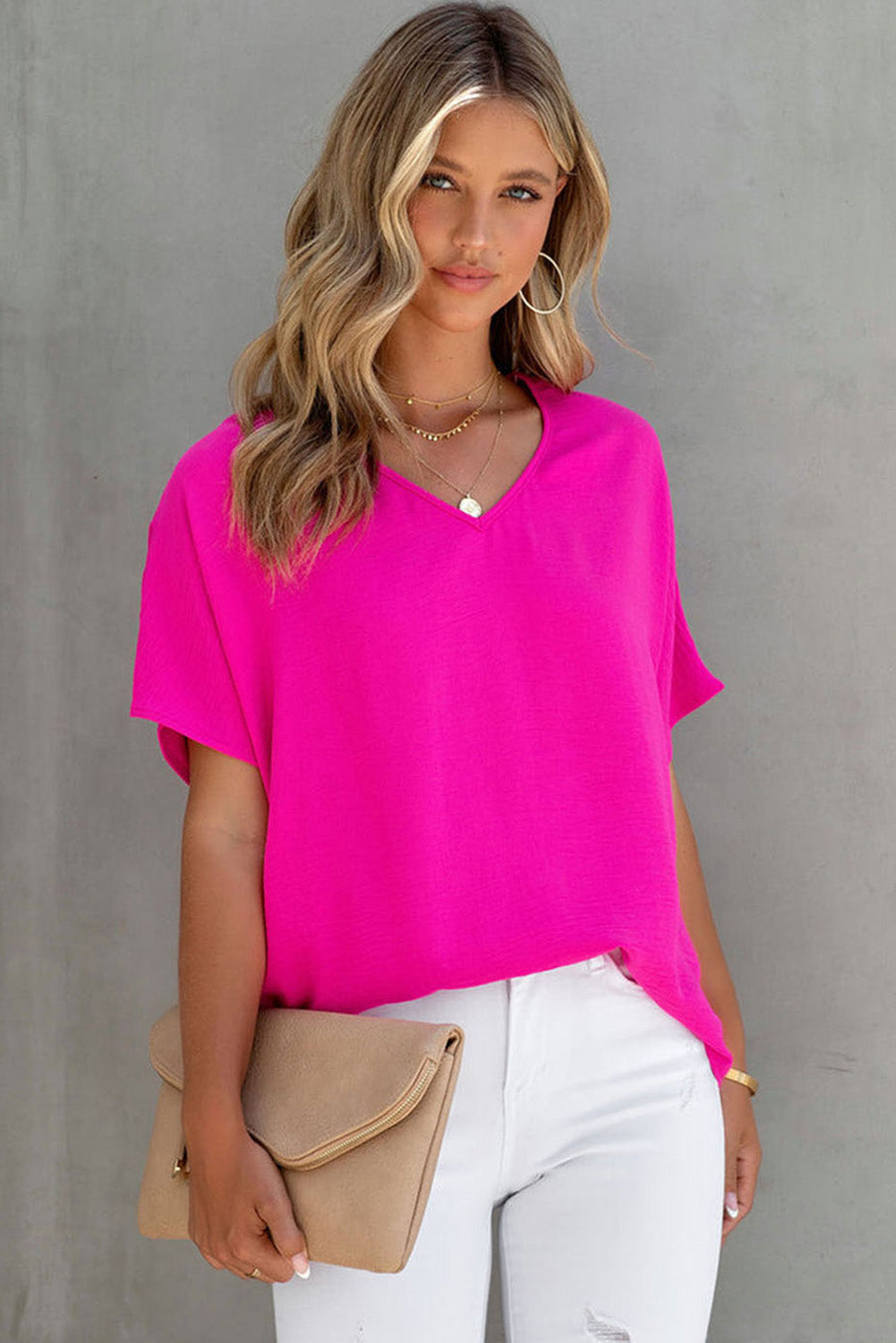 Blusa básica de color liso con escote en V y manga corta en rosa