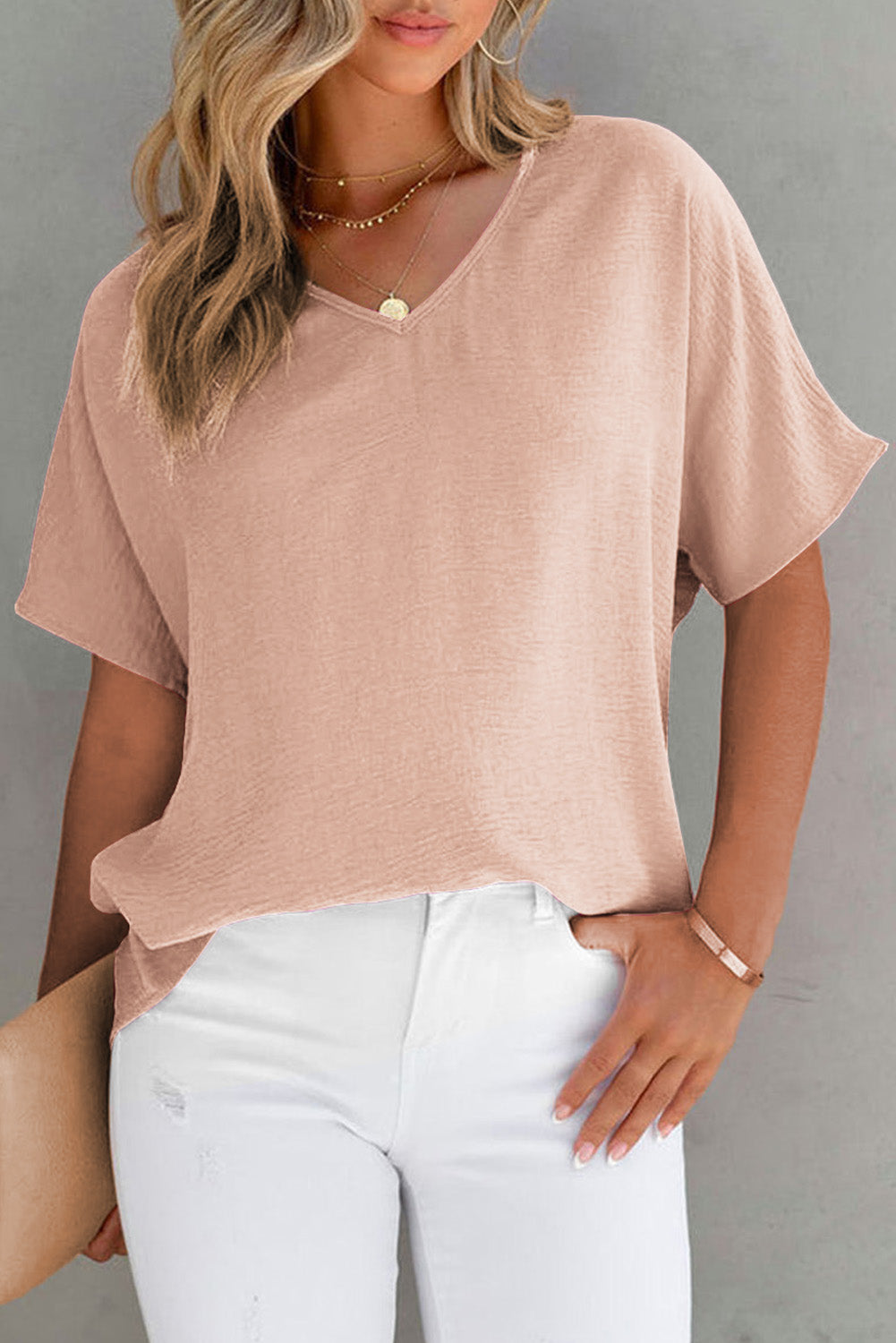 Blusa básica de color liso con escote en V y manga corta en rosa