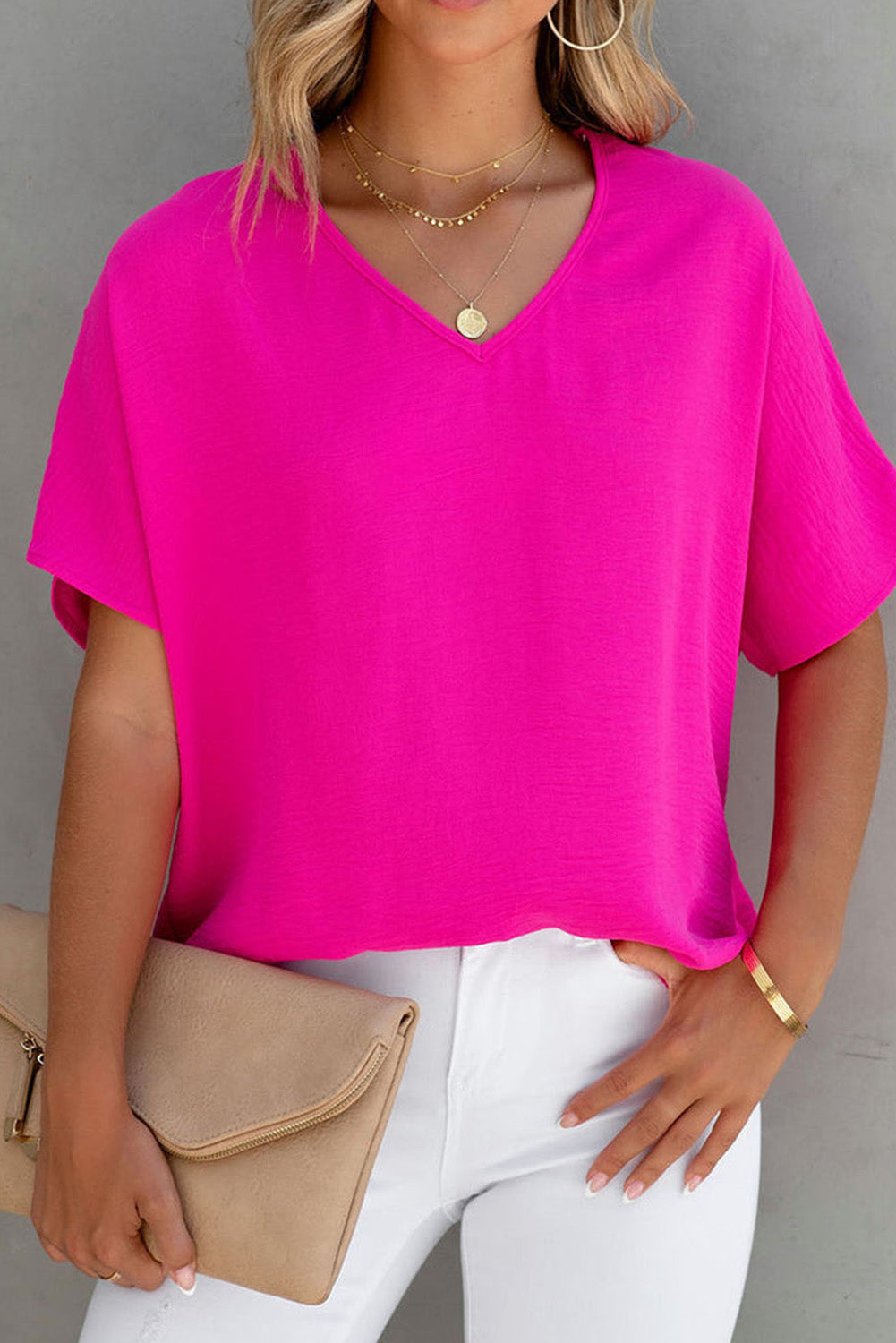 Blusa básica de color liso con escote en V y manga corta en rosa