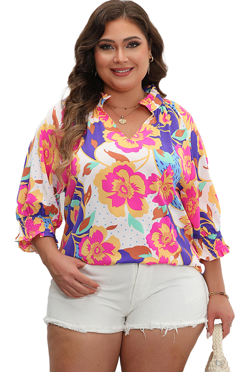 Blusa de manga corta abullonada con cuello dividido y estampado floral en color rosa y rojo