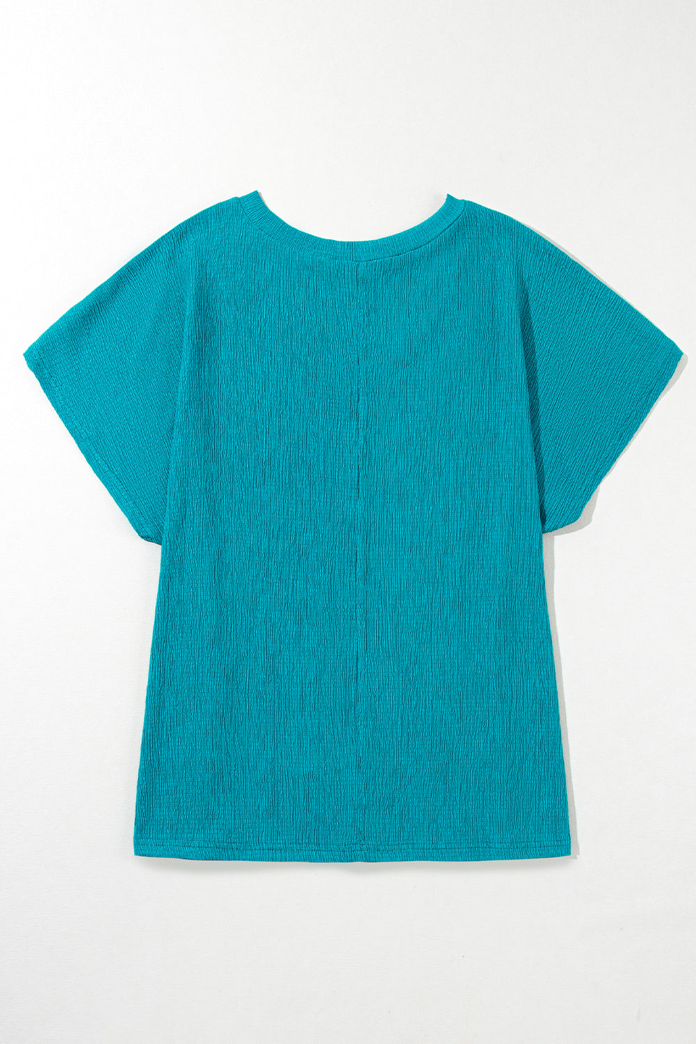 Blusa con escote en V y textura en color azul zafiro de talla grande