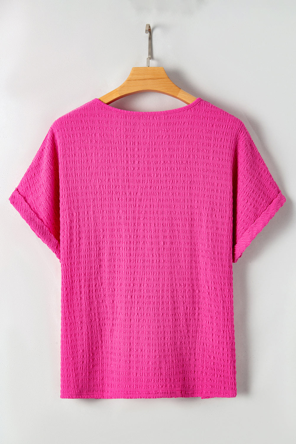 Blusa de talla grande con escote en V y mangas murciélago con textura en color rosa brillante