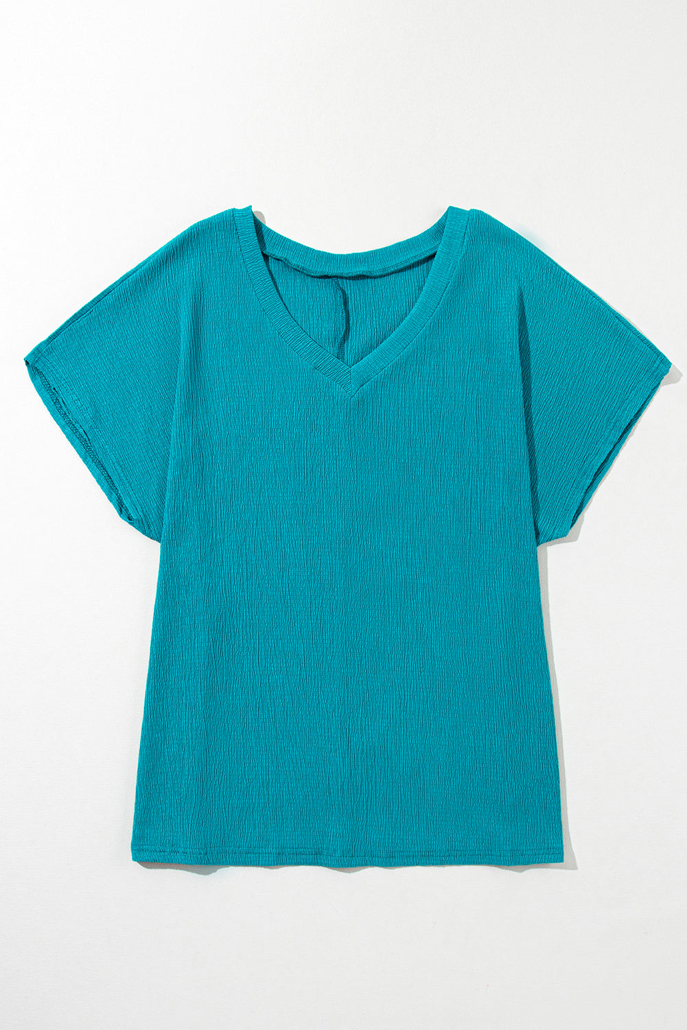 Blusa con escote en V y textura en color azul zafiro de talla grande