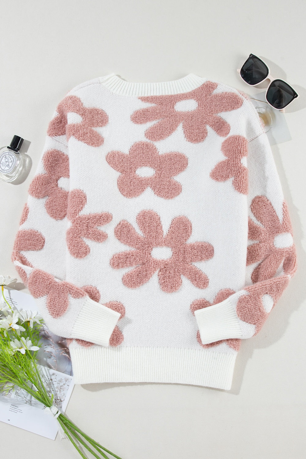 Blusa de punto con cuello redondo y manga larga con flores