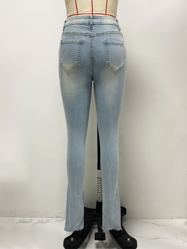 Asymmetrical button fly skinny jeans